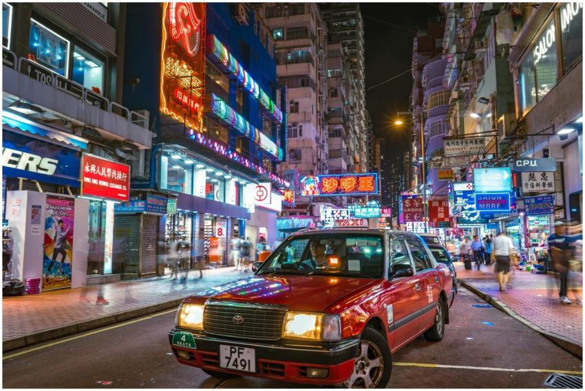 Bustling Hong Kong street at night with neon light