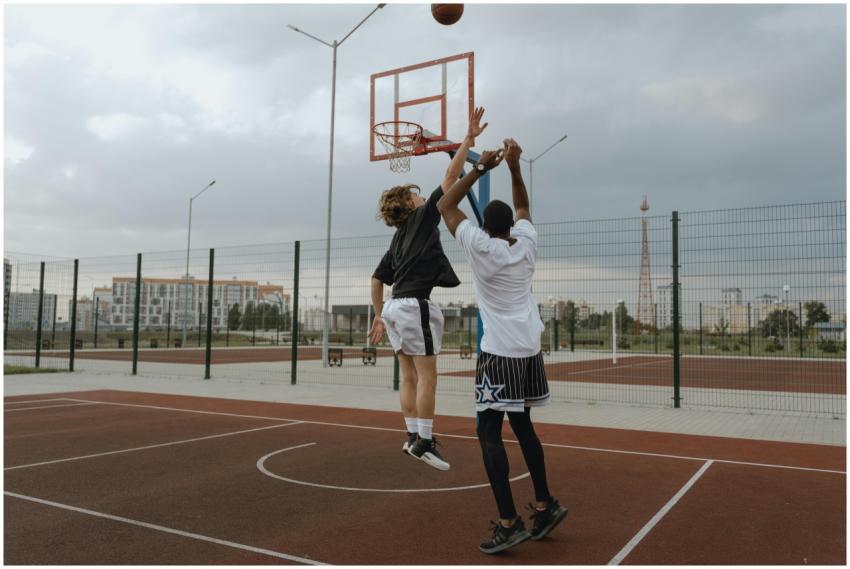 Dynamic shot of two athletes playing basketball on