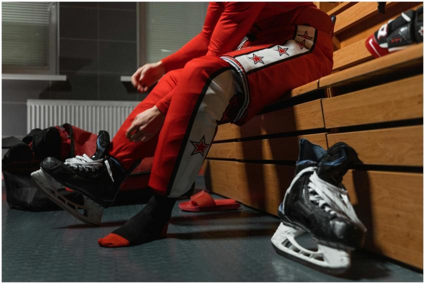 Ice hockey player wearing skates and gear in a loc