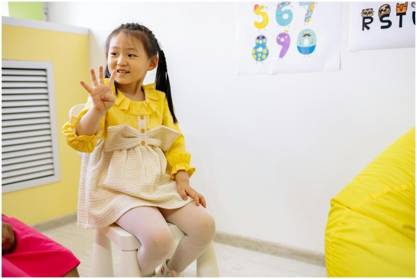 Young girl in a classroom setting learning numbers
