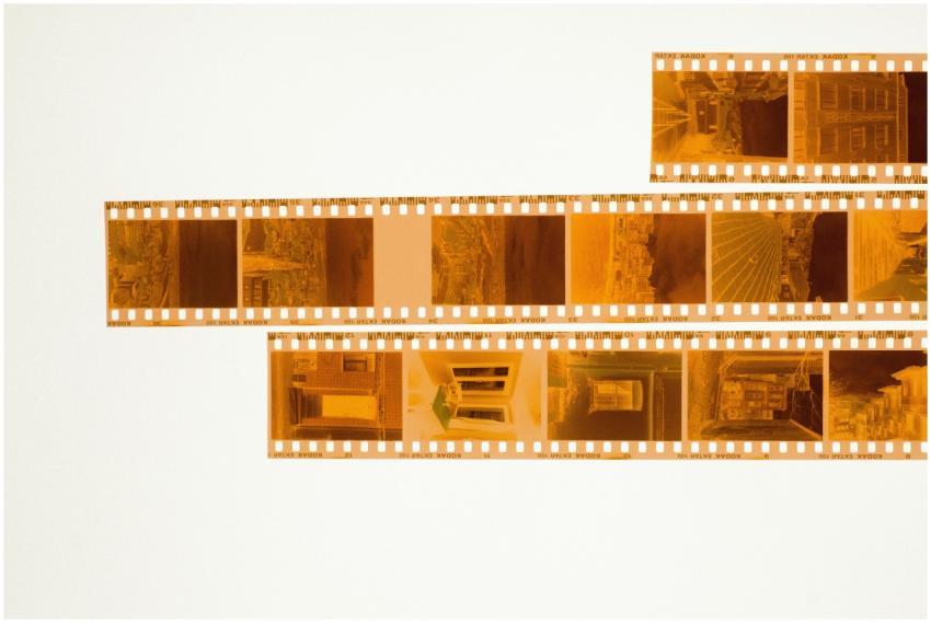 A set of film negatives laid out on a light table,