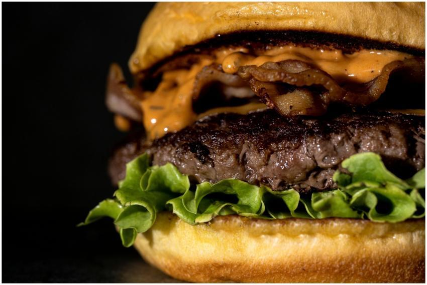 A mouth-watering hamburger featuring juicy beef, c