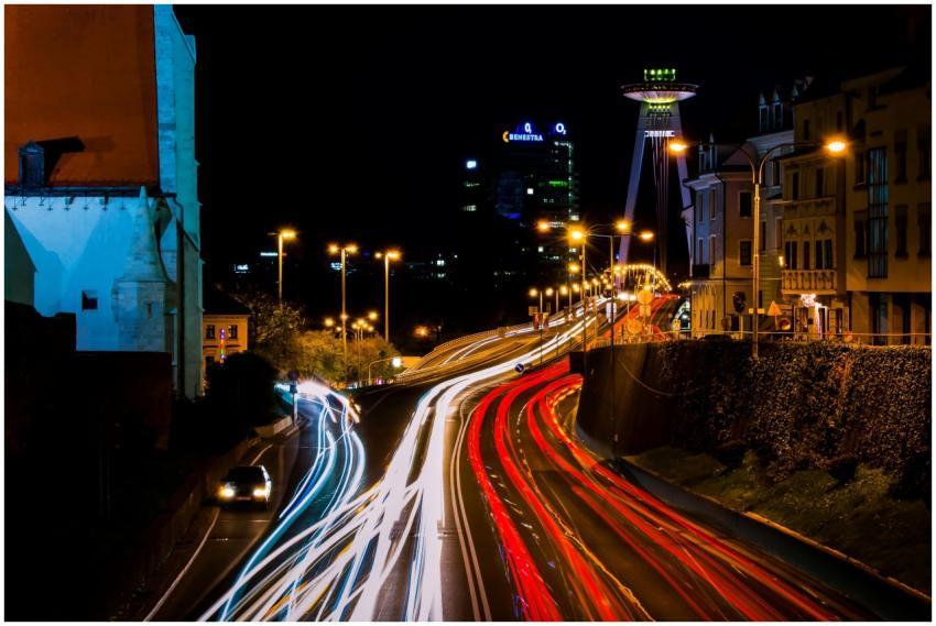Vibrant city night scene with dynamic light trails