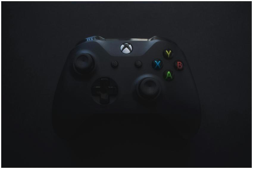 Xbox controller illuminated against a dark backgro