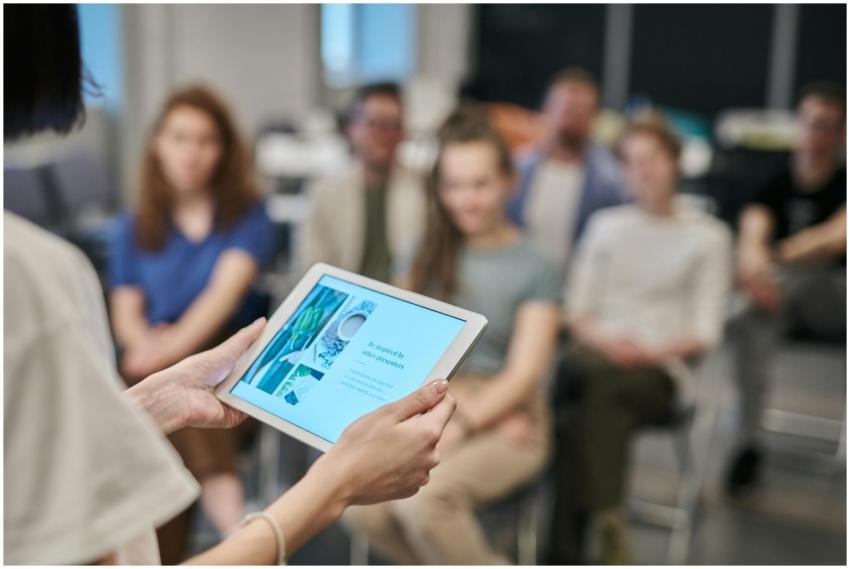 Business seminar with participants focused on a ta