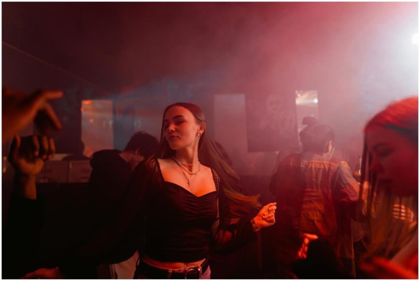 Energetic party scene showing people dancing in a