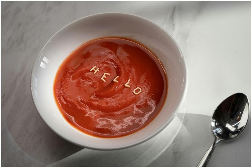 Stylish bowl of tomato soup with alphabet pasta sp