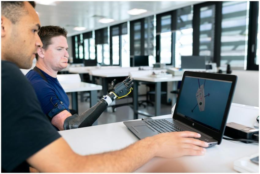Two engineers collaborate on prosthetic design usi