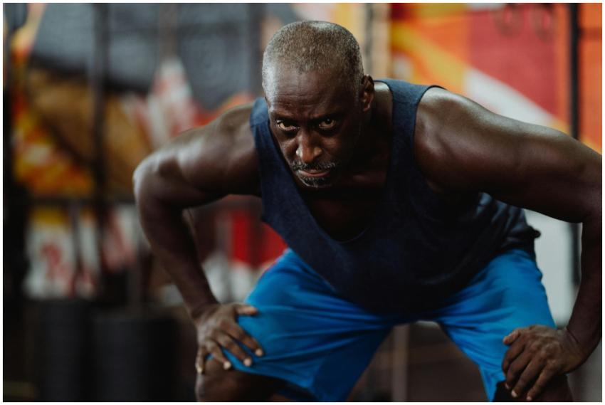 A determined athlete performing a squat during an