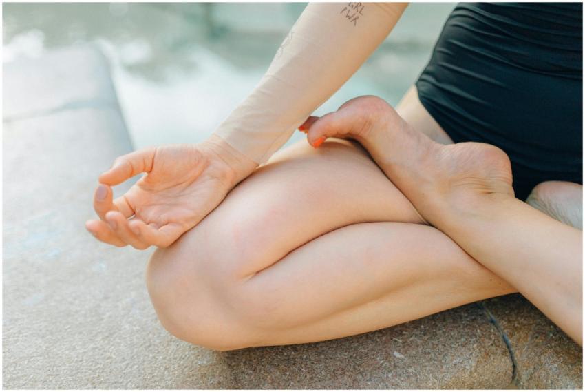 Close-up of a person meditating outdoors, focusing