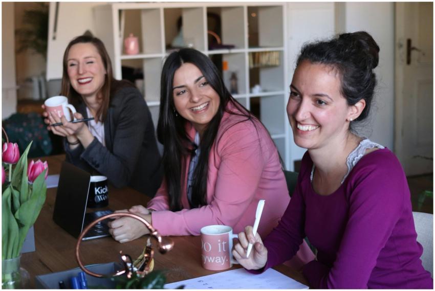 Three women enjoying a collaborative and friendly