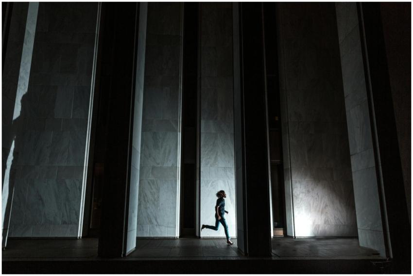 Dynamic silhouette of a person running through an