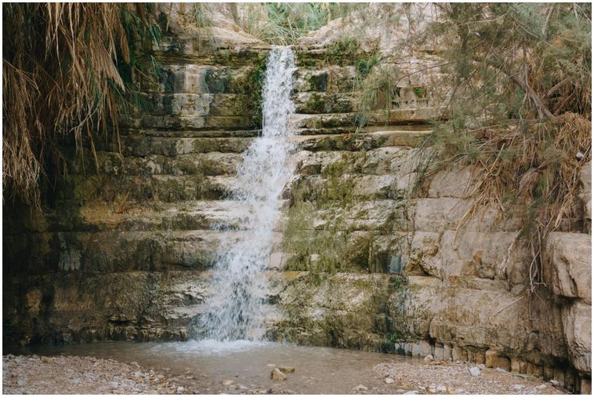 Beautiful waterfall cascading over mossy rocks in