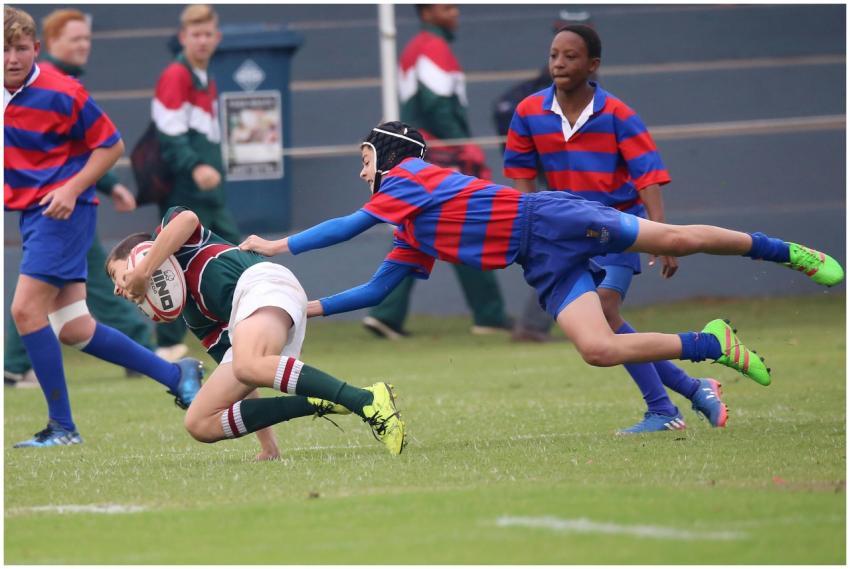 Young athletes engaged in a dynamic rugby match, s