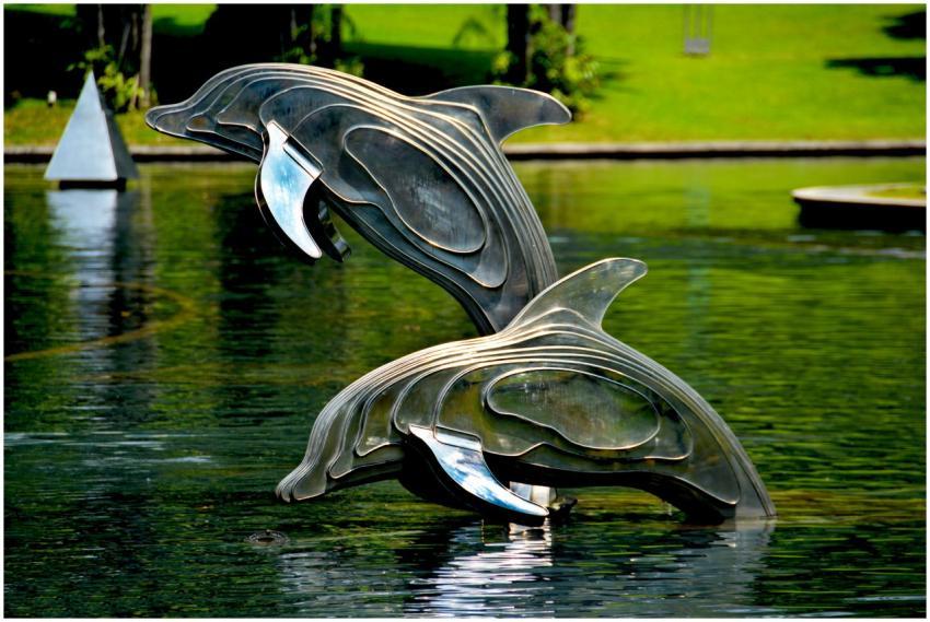 Stainless steel dolphin statues jump gracefully in