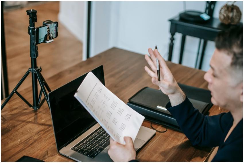 A man conducting an online teaching session using