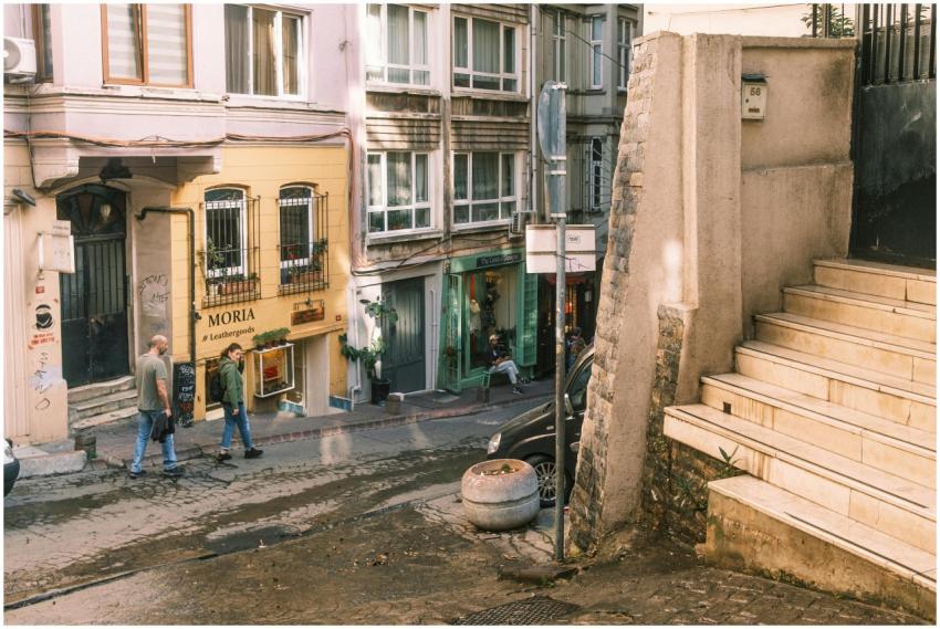 Charming urban scene featuring shops, pedestrians,
