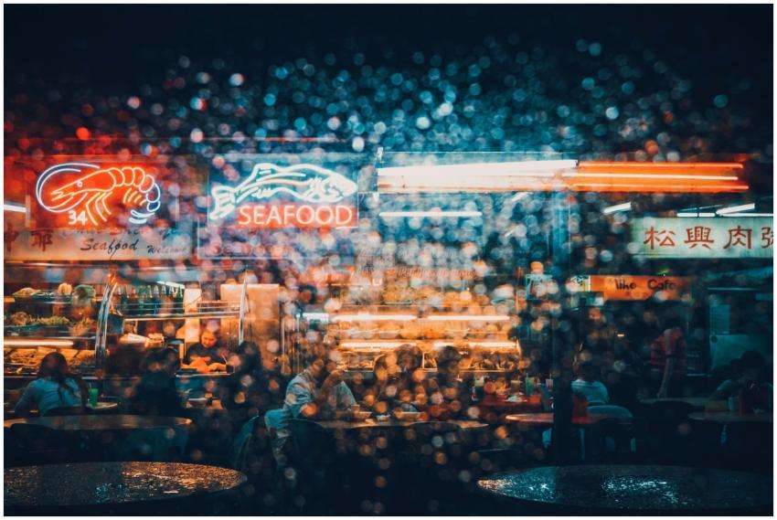 Explore the neon-lit ambiance of a bustling seafoo