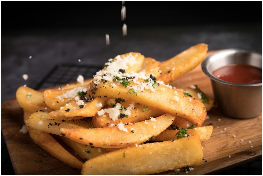 Delicious golden french fries topped with grated c