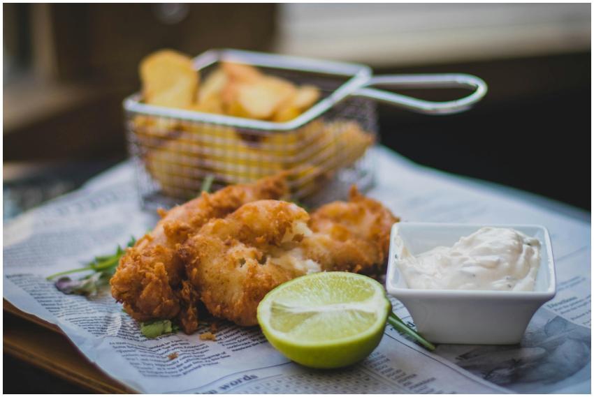 Close-up of fried fish and chips with tartar sauce