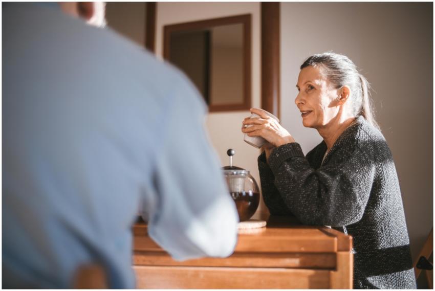 Cheerful senior couple enjoying coffee together in