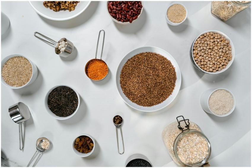 Top view of various grains, legumes, and spices in