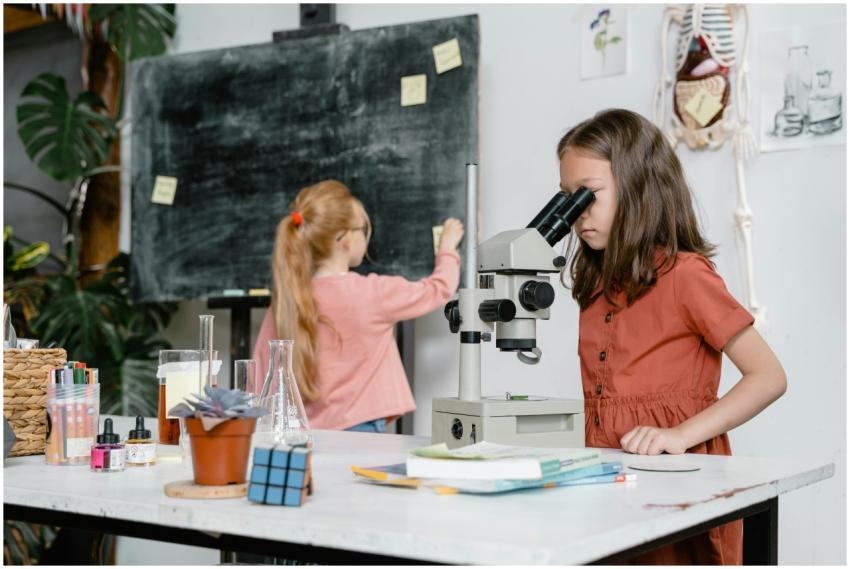 Two girls engaged in a science experiment using a
