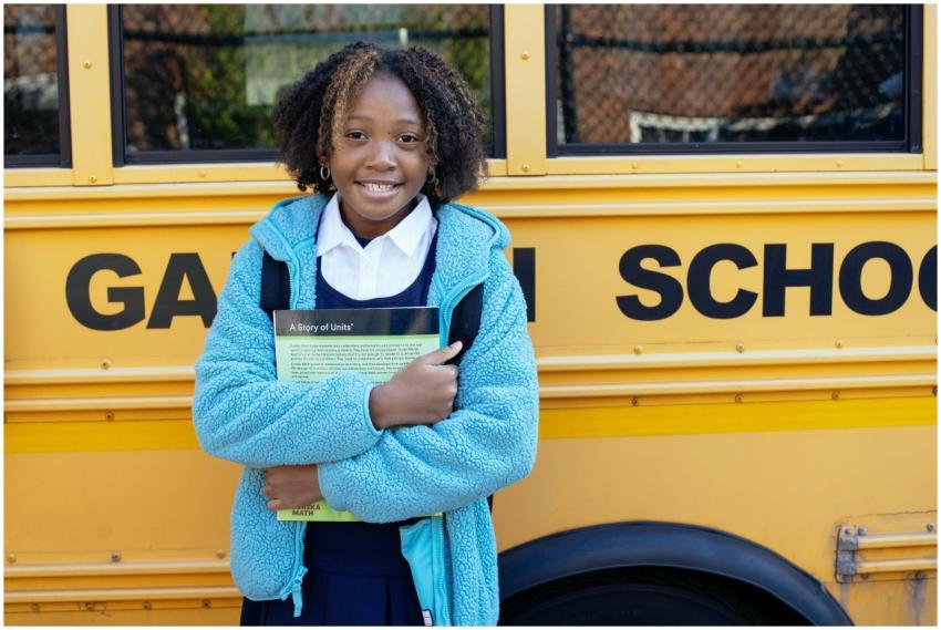 Cheerful African American girl in school uniform a