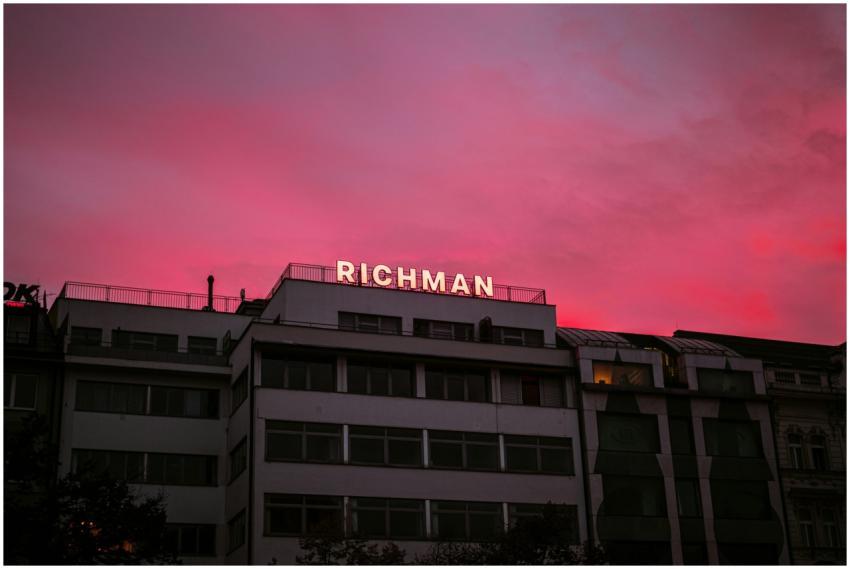 Modern urban building with richman sign against a