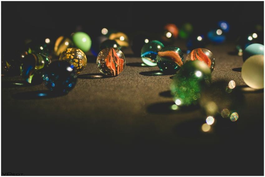 A vibrant collection of glass marbles glistening o