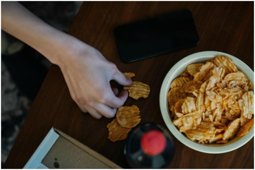 From above of crop anonymous person with crispy po