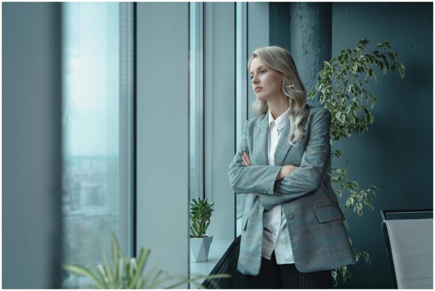 Professional businesswoman in elegant attire looks