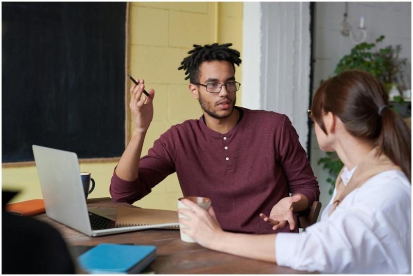 Two colleagues engaged in a collaborative discussi