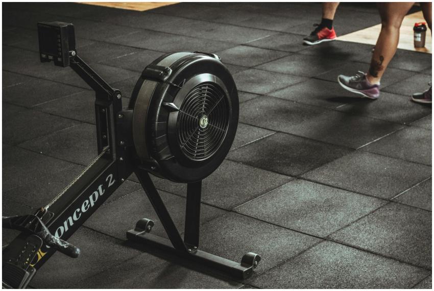A gym scene featuring fitness equipment and active