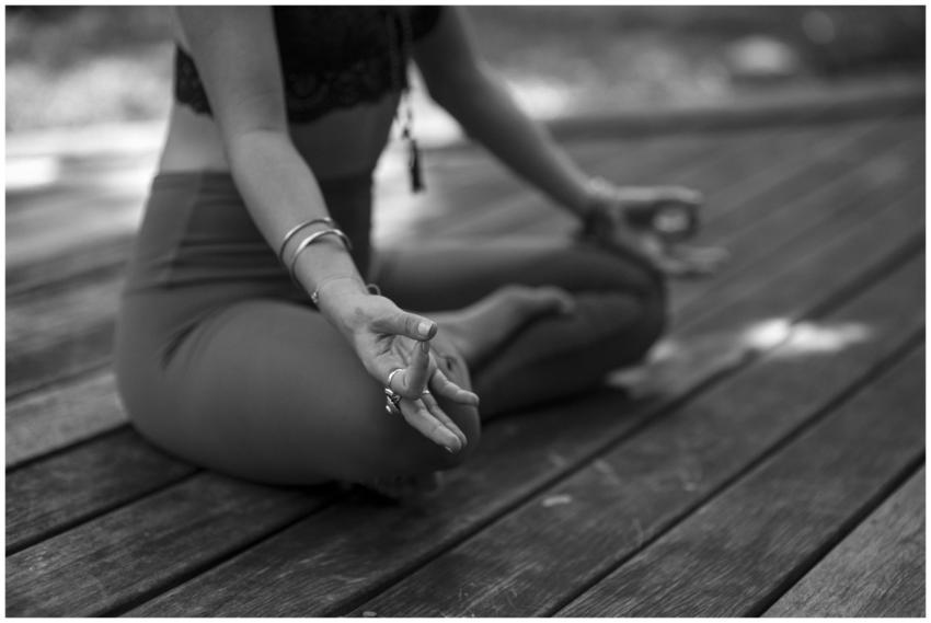 A person practicing yoga in outdoor setting, focus