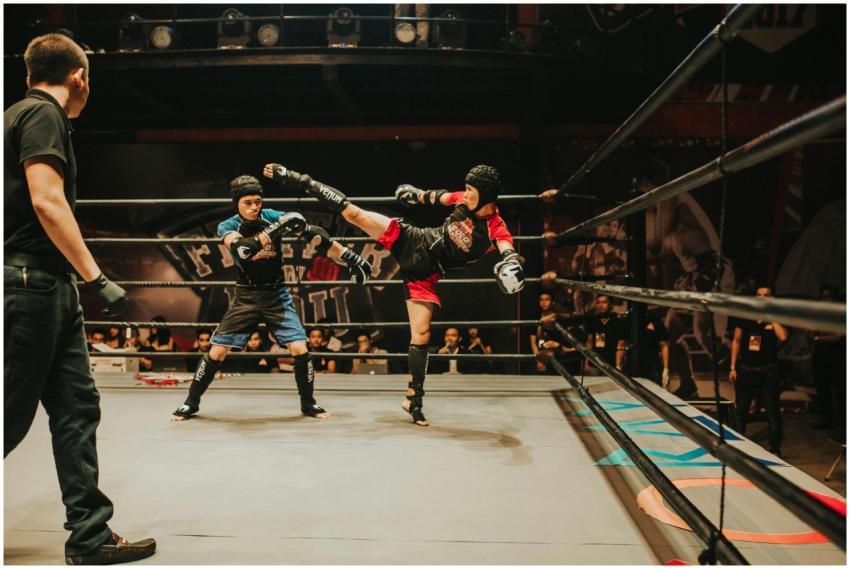 Intense kickboxing match with fighters in action i