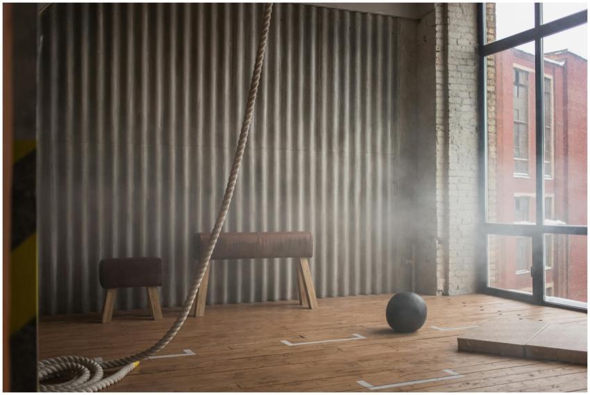 Industrial-style gym interior featuring pommel hor