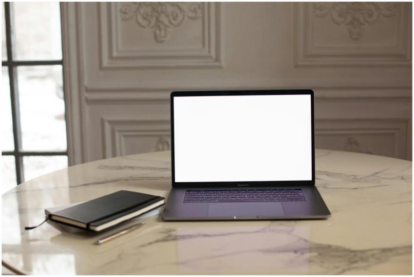 Laptop with blank screen on a luxurious marble tab