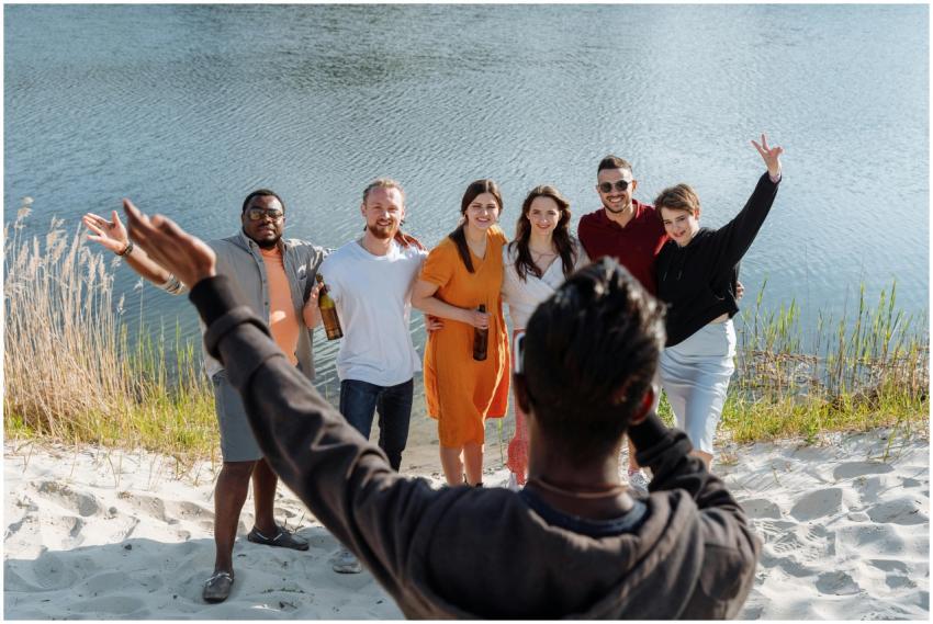 A group of friends enjoying a sunny day by the lak