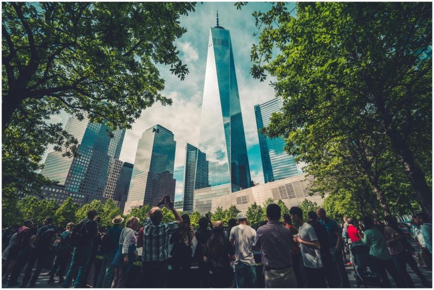 Crowd at One World Trade Center, surrounded by gre