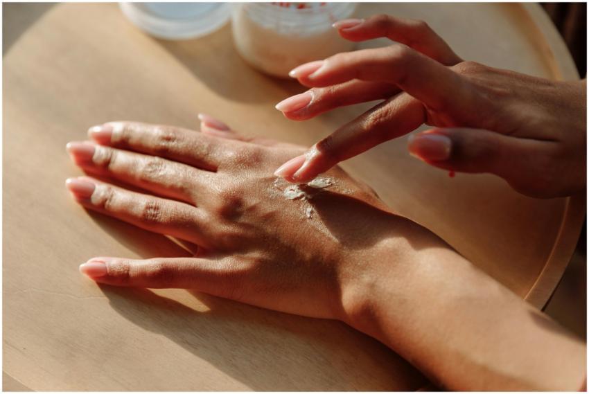 Hands applying moisturizing cream for healthy skin