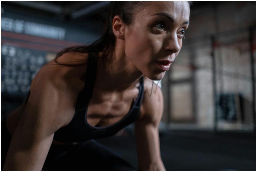 Close-up of a determined female athlete sweating d