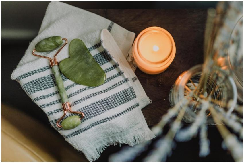 A serene spa setup featuring a jade roller, gua sh