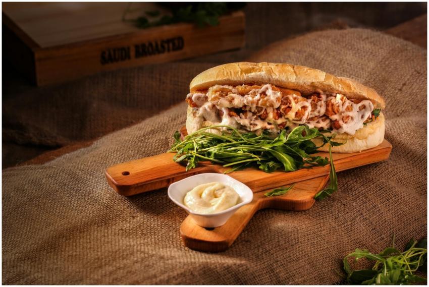 Mouth-watering chicken sandwich with greens on a r