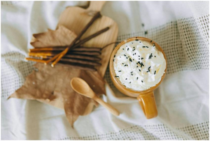 Warm cup of hot chocolate topped with cream, perfe