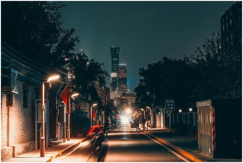 Urban street scene in Beijing at night with skyscr