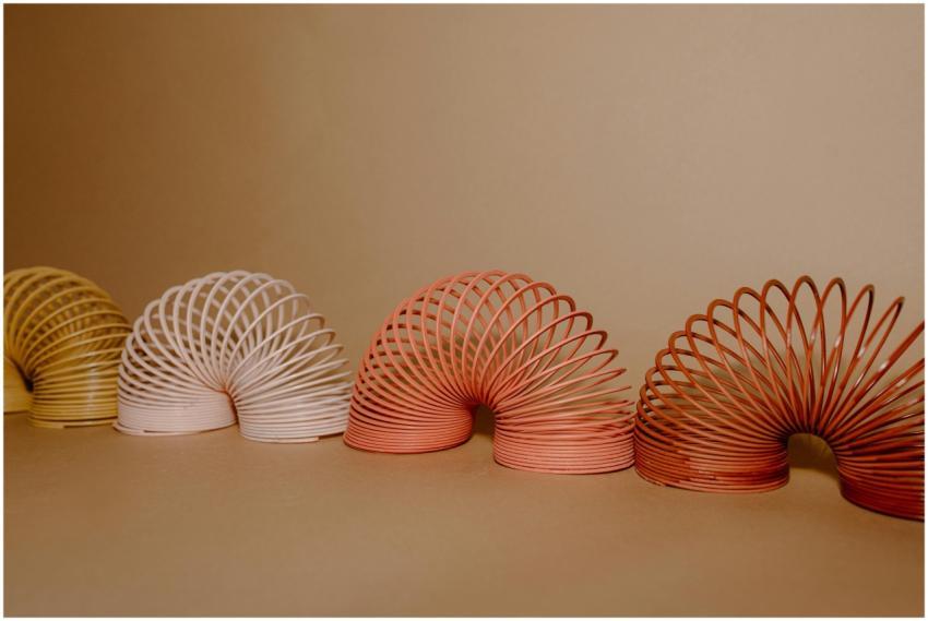 A vibrant row of Slinkies displaying gradient rain