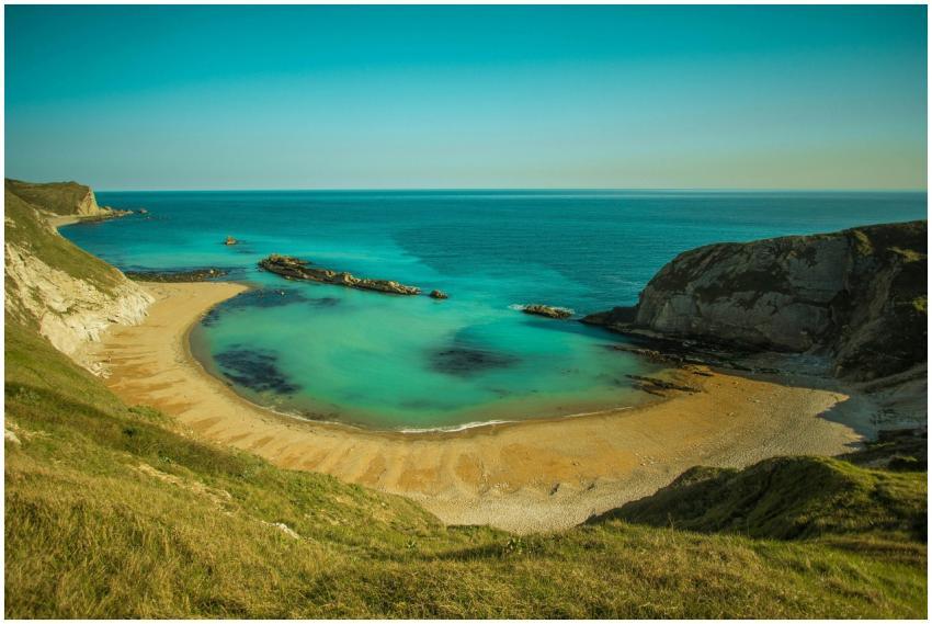 Beautiful beach cove with clear turquoise waters a