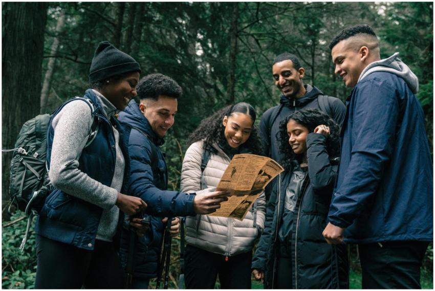 Diverse group of friends hiking together, planning
