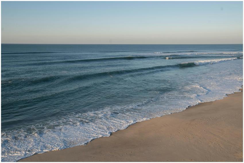 A peaceful view of waves gently washing over the s